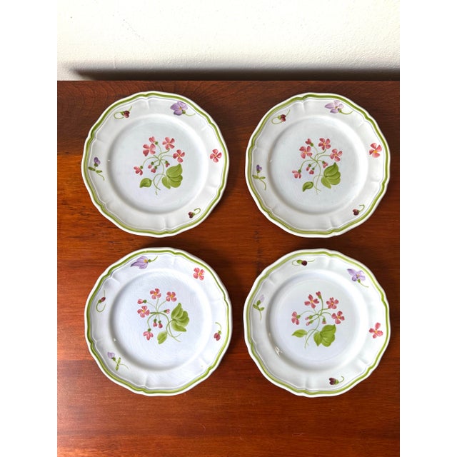 Charming set of four hand-painted French dessert plates by Longchamp, marked “Longchamp Décor Inaltérable – Peint à la...