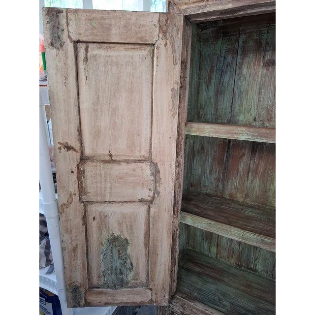Hand carved Indian cabinet. Reclaimed wood door panels with diamond pattern and floral motifs, circa 1880. Distressed...