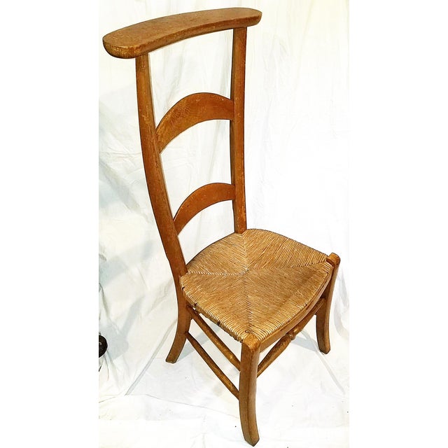150 year old French country ladderback prayer chair, 'prie diueu' with rushed seat in solid aged condition.