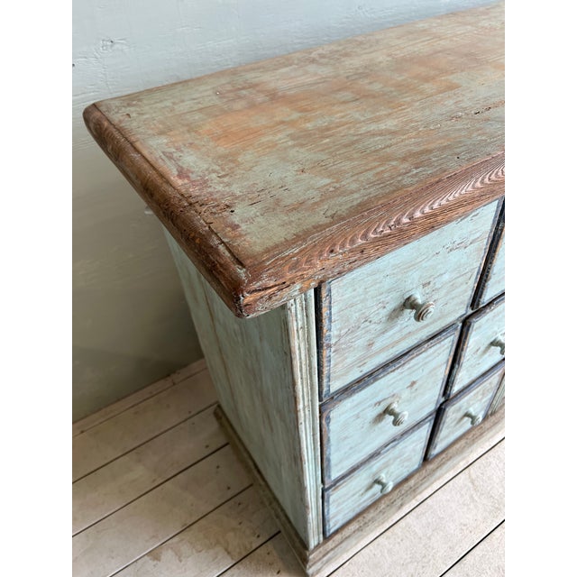 Handsome Italian multi drawer credenza with natural wood top and painted cabinet. This lovely sideboard credenza is the...