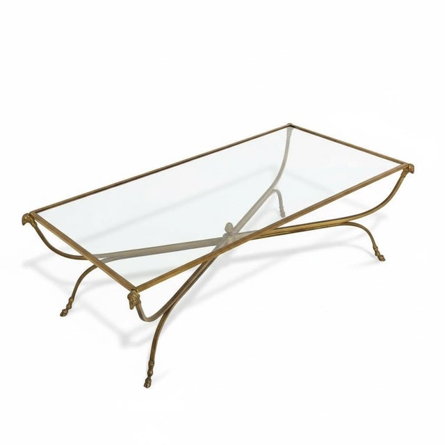 This is an Italian brass and glass coffee table with neoclassical Maison Jansen styling. The glass is original, and the...