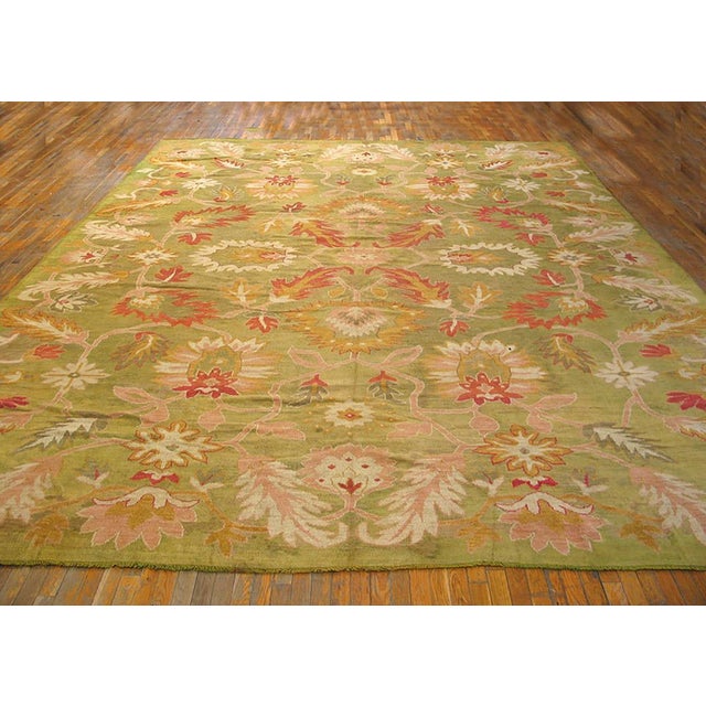 Few Oushaks abolish the classic field/border convention at so early a date. The frame-less light green field shows a bold,...