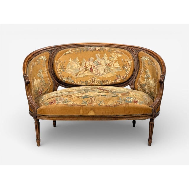 Louis XVI Style, Canape or Settee, Tapestry, Walnut, France, 20th c. A walnut salon settee from 20th century France in the...