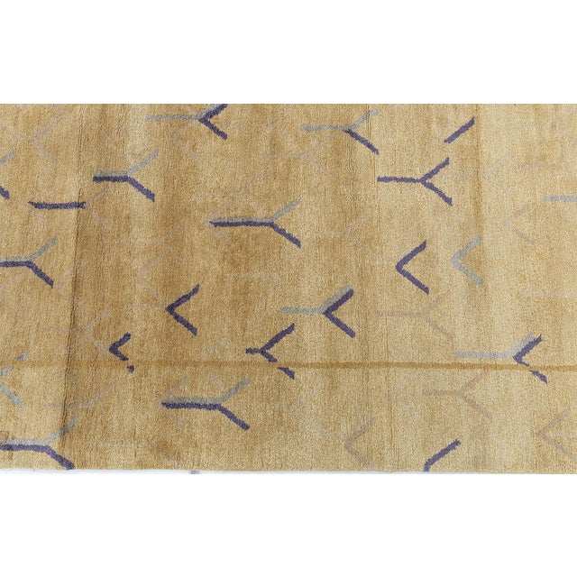 This striking Tibetan rug weaves together texture, warmth, and refined geometry with artistry. Hand-knotted in a luxurious...