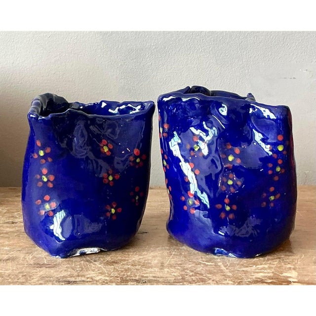 This captivating pair of petite studio pottery vessels showcases highly textured, expressive forms with intentionally...