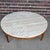 This lovely coffee table by Lane has a solid wood circular base with 4 legs and a cross-supported circular frame. The...