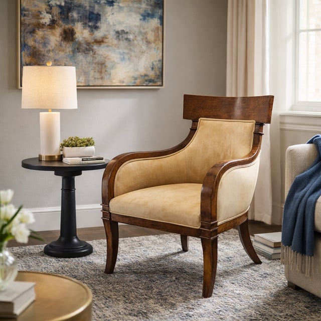 A sculptural chair with a strong architectural profile and inviting proportions that draws on Klismos and gondola forms....