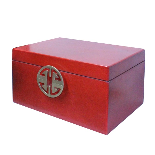 This is a decorative box in a rectangular shape and matte golden color round hardware accent. The surface is a layer of...