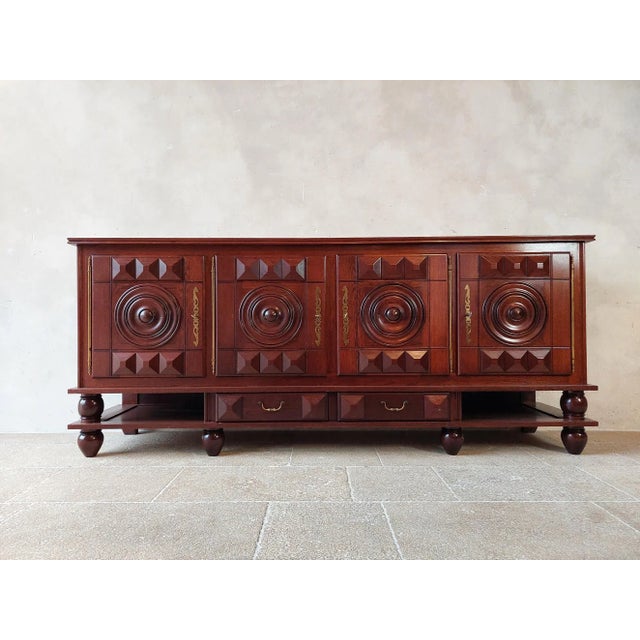 Beautiful large sideboard by charles dudouyt in dark brown walnut with a polished finish. Made in the 1940s. Four doors...