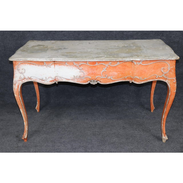 Richly weathered, and full of old-world European charm, this Italian Venetian style writing desk is a striking example of...