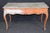 Richly weathered, and full of old-world European charm, this Italian Venetian style writing desk is a striking example of...