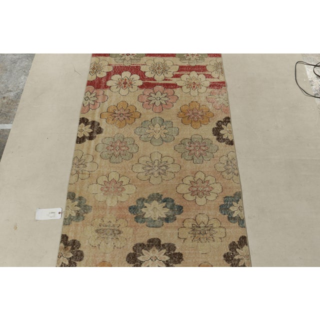 Hand-knotted in Turkey originating between 1960-1970, this vintage mid-century rug is the latest to join our Midcentury...
