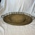 Offered here is a pair of vintage brass drink trays. The set includes one grand oval tray and a smaller nesting round...
