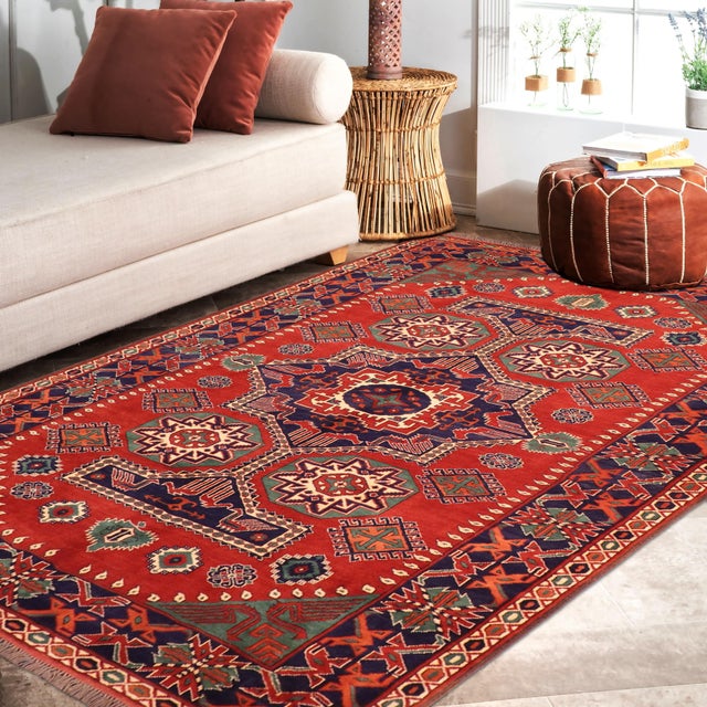 Enhance your home with the timeless craftsmanship of a hand-knotted Kargahi wool rug, celebrated for its tribal artistry,...