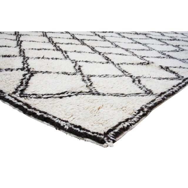 One-of-a-kind hand-knotted Moroccan rug in soft, organic wool with an elaborate doubled rhythmic pattern of Berber lozenge...