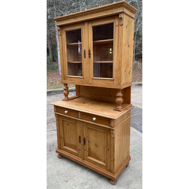 Love this European pine cupboard with glass doors on top with three shelves and dove tailed drawers on bottom. Key is...