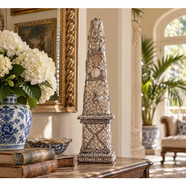 A wonderfully decorative late 20th-century coquillage obelisk, its classical architectural form completely encrusted with...