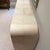 RH Lucien Parchment Console A minimalist silhouette combined with luxurious materials. A waterfall shape is wrapped in...