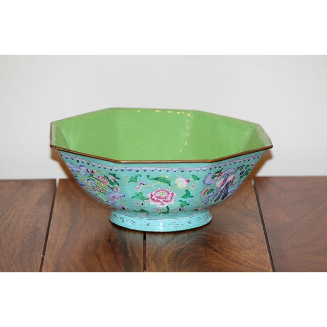 A beautiful Chinese canton enamel bowl with an apple green interior and a turquoise exterior. Hand-painted with images of...