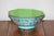 A beautiful Chinese canton enamel bowl with an apple green interior and a turquoise exterior. Hand-painted with images of...