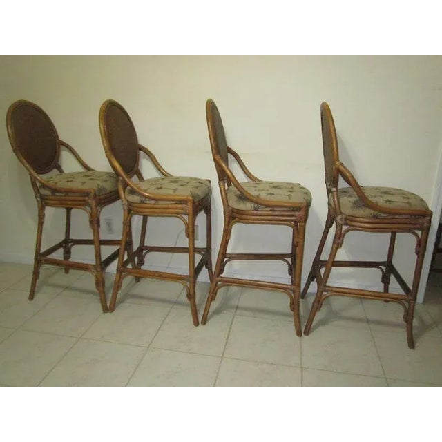 Add a touch of sophistication to your home bar with this set of three Tommy Bahama style barstools. The upholstered seat...