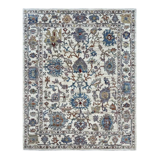 Oushak Handmade Wool Rug With Ivory and Blue Floral Pattern For Sale