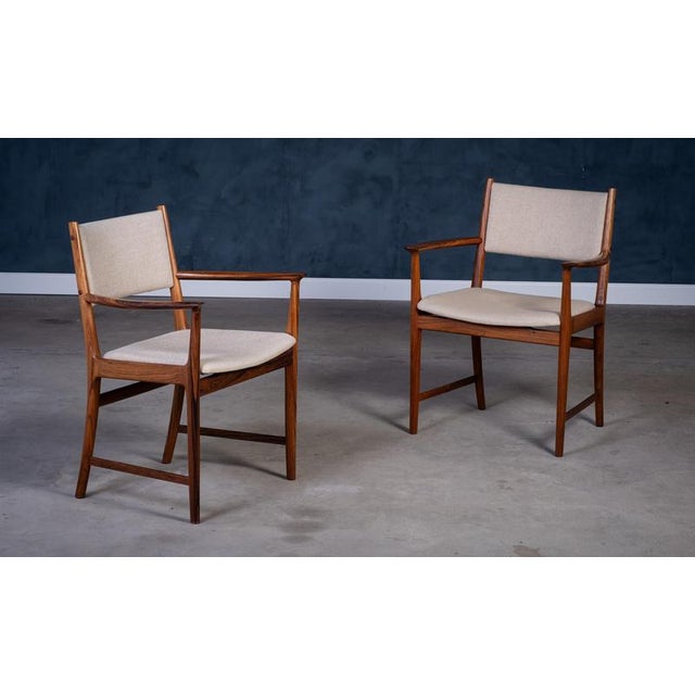 Elegant pair of Danish mid-century armchairs designed by Kai Lyngfelt Larsen and produced by Søren Willadsen in the 1960s....