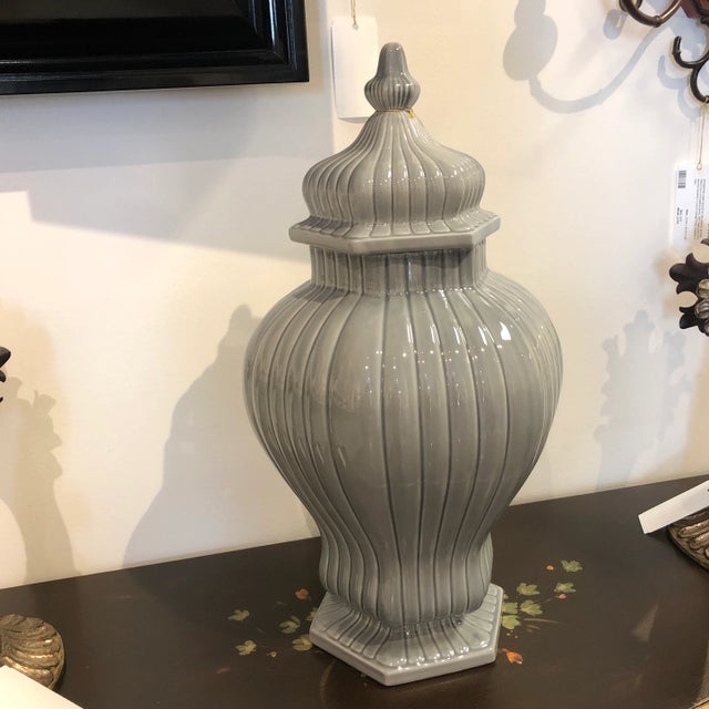 Italian ceramic vase with lid featuring a ribbed texture and fluted hexagon shaped body design. Created by the talented...