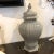 Italian ceramic vase with lid featuring a ribbed texture and fluted hexagon shaped body design. Created by the talented...