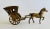 Reminiscent of times gone by this small solid brass horse and carriage would bring attention anywhere it is exhibited in...