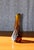 A slender, sculptural studio glass vase by hungarian master glassblower gyula budveszel, dating from the 1990s. The deep...