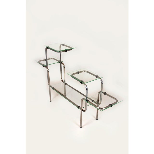 A sculptural plant stand produced in Czechoslovakia in the 1930s–1940s. Made of bent chromed steel with an asymmetrical,...