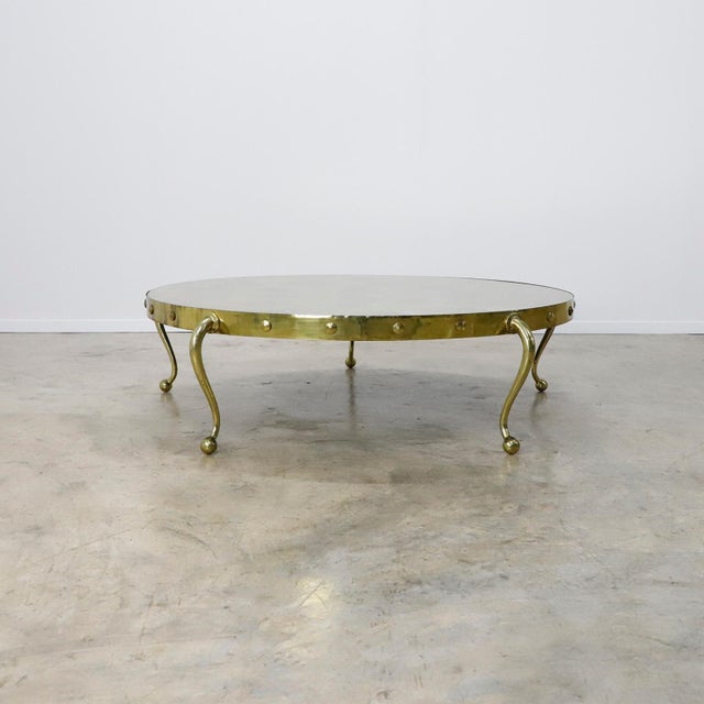 Circa 1960. We offer this cocktail table designed by Arturo Pani, the table are made in solid bronze whit spectacular legs...