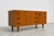 Danish Mid Century Modern teak credenza in a rare low height and perfectly scaled for smaller spaces. This well-crafted...