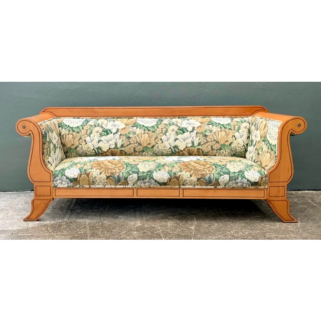 Embrace the refined elegance of 19th-century aesthetics with this striking Biedermeier-style sofa. Defined by its...