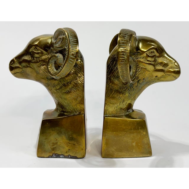 Substantial vintage pair of solid brass rams head bookends featuring great detail to horns and bust. Heavy. Nice patina.