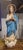 This Immaculate Conception figurine represents the Virgin Mary in a serene devotional posture, standing gracefully over a...