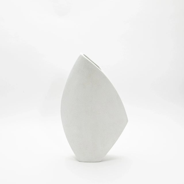 The Oval Vase with the Side Cut Top in Shagreen by R&Y Augousti is a stunning embodiment of refined craftsmanship and...