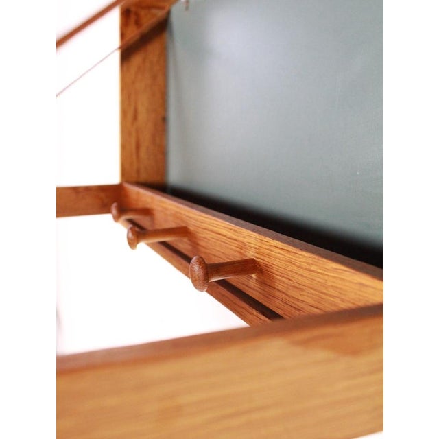 Wall mounted folding coat hanger in oak designed by Adam Hoff & Poul Østergaard Produced by Virom Møbelsnedkeri, 1960s....
