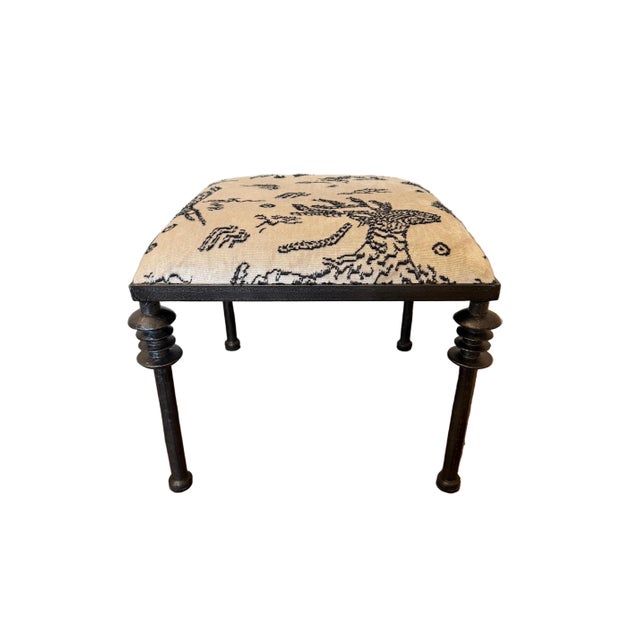 Crafted with stacked iron leg details and custom upholstered seat cushion Ready to ship