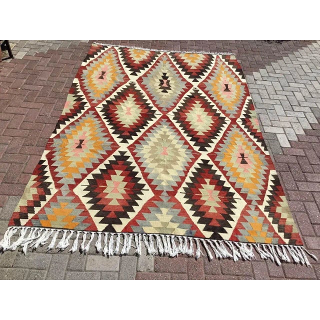 This beautiful, vintage, handwoven kilim is approximately 60 years old. It is handmade of very fine quality, hand-spun...