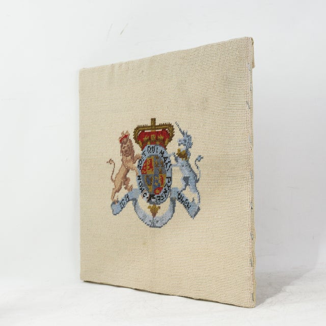 This sophisticated vintage needlework piece features a meticulously rendition of the British Royal Coat of Arms set...
