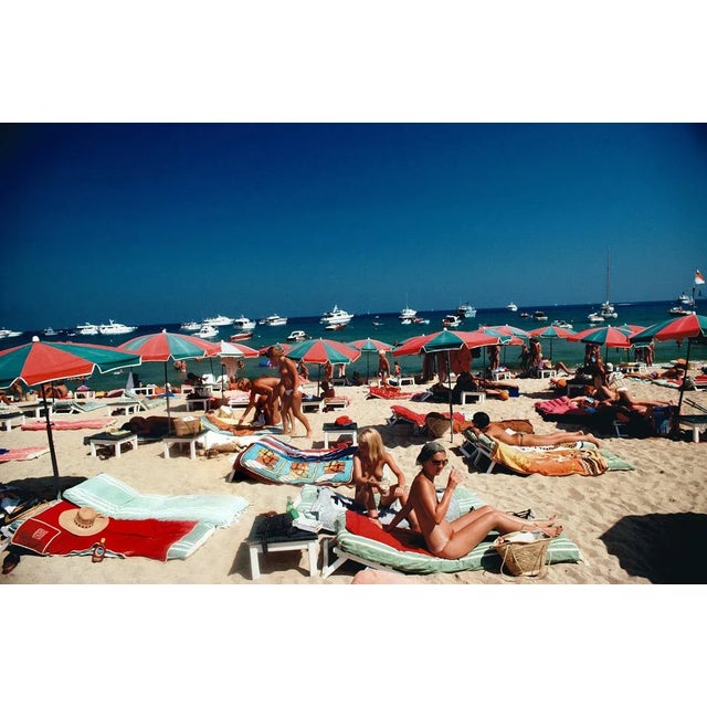 Beach at Saint Tropez 1977 Sunbathers on the beach at St. Tropez, France, 1977.. (photo Slim Aarons) Slim Aarons was one...