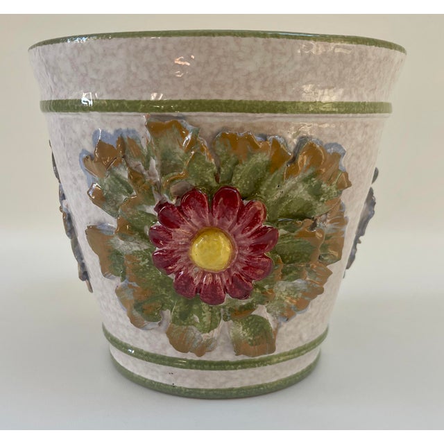 Gorgeous hand-decorated Italian majolica planter or cachepot with large center floral motif to sides. Maker's mark on...