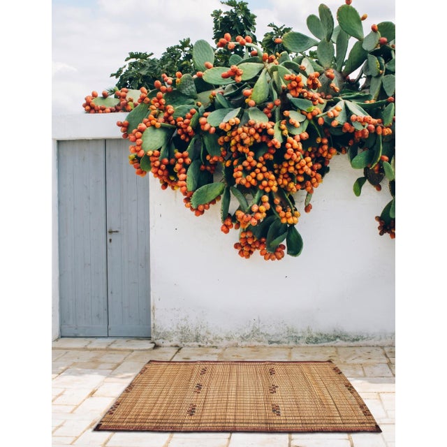 Vintage Tuareg Mat | Handmade in Mauritania, Reed Mat with Scattered Stitched Accents and Rust-Red Edging This quietly...