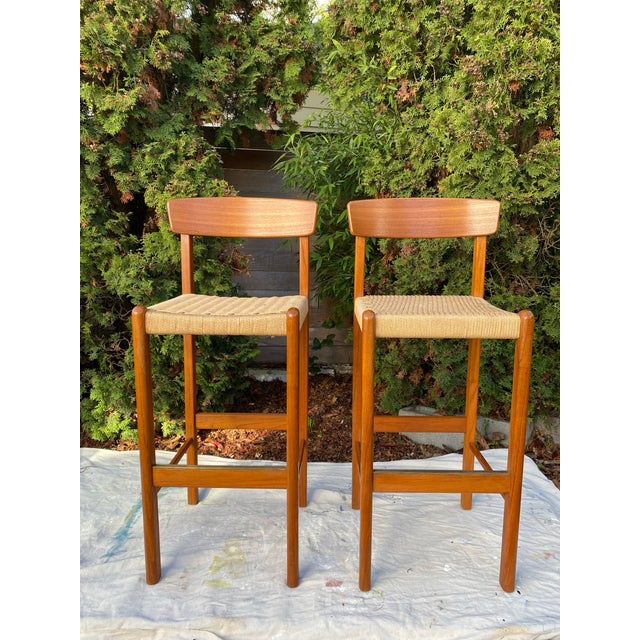 Pair of authentic mid-century modern bar stools by Sun Cabinet Co. featuring solid teak wood frames at bar height (31")....
