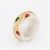Stylish vintage white jade & gemstone ring (circa 1960s to 1970s) crafted in 18k yellow gold. Pear shaped rubies and...