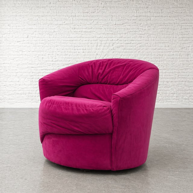 A striking blend of Postmodern and Mid Century Modern design, this Vladimir Kagan styled swivel lounge chair features bold...