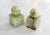 Pair of sculptural modernist bookends: cubic base supporting a sphere Made entirely of marbled/veined ochre green onyx...