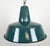 Industrial green enamel pendant light made in Poland during the 1960s. White enamel inside the shade. Iron top. The socket...